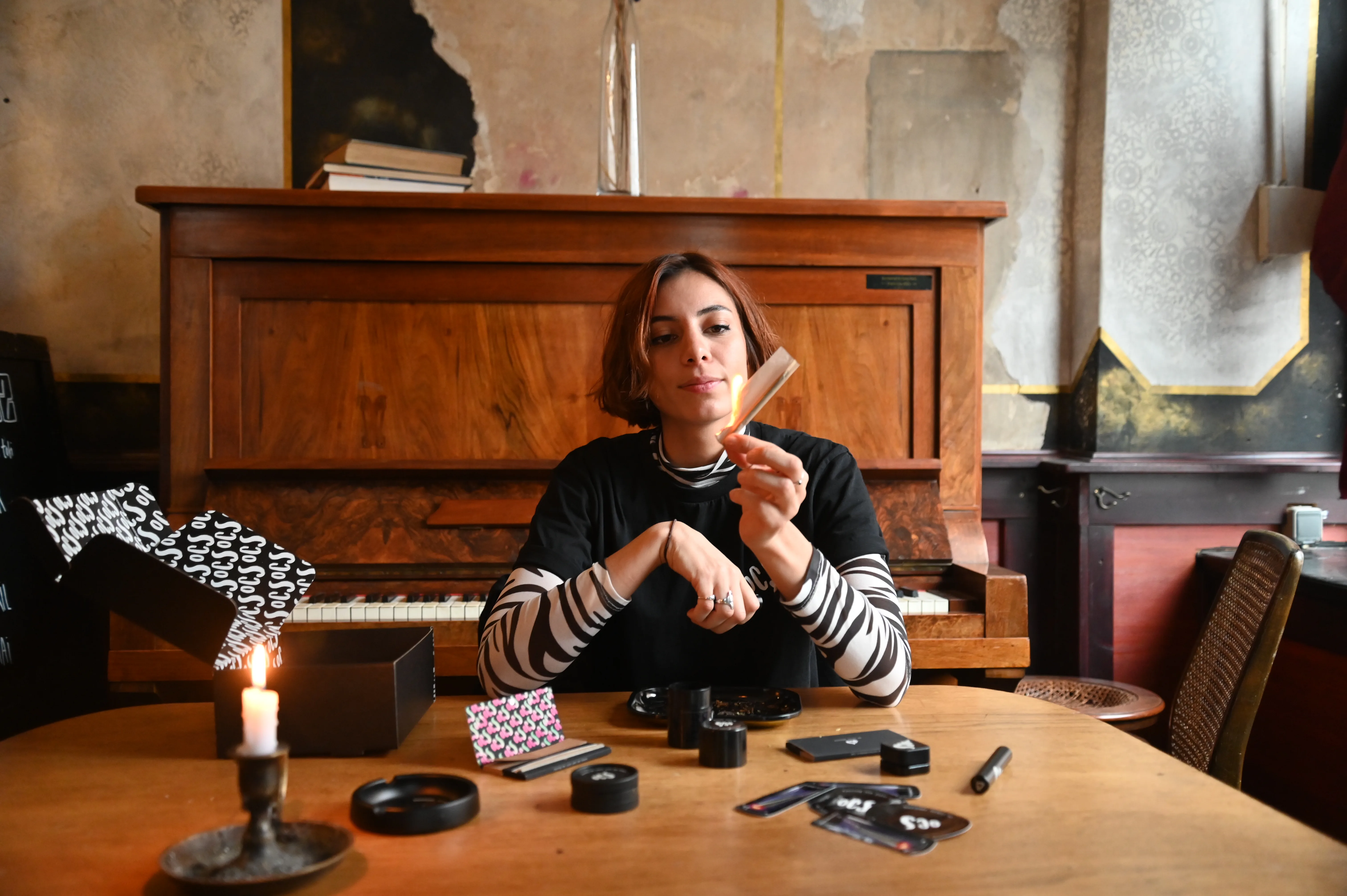OCS products laid out on a table — papers, ashtray, grinder, the patterned box.